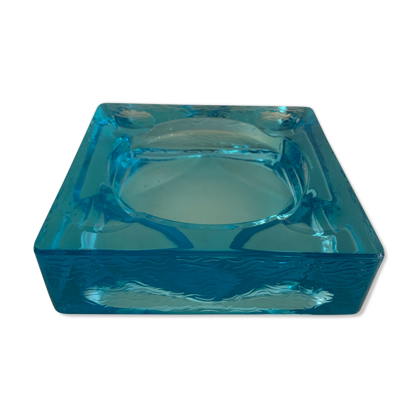 Ashtray paved in blue glass