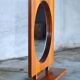 Round wall mirror with teak shelf by Pedersen & Hansen