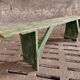 Old wooden bench side table grass green