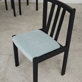 Set of 6 modernist black chairs with light blue-green ribbed fabric.