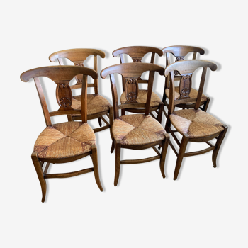 6 antique wooden chairs and straw seat