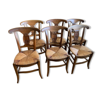 6 antique wooden chairs and straw seat