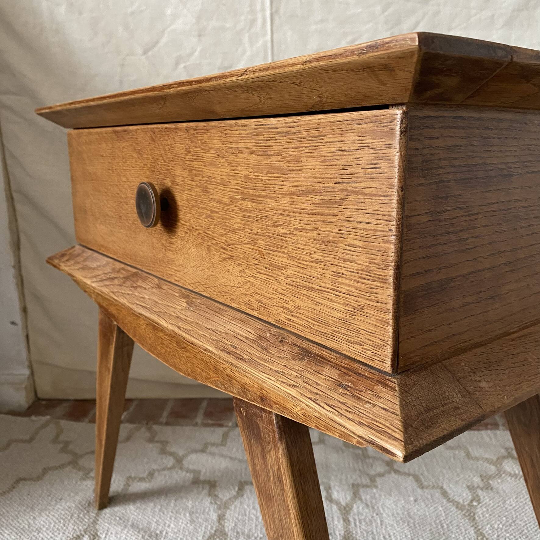 Scandinavian style bedside table with tapered legs from the 1960s.