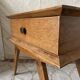 Scandinavian style bedside table with tapered legs from the 1960s.