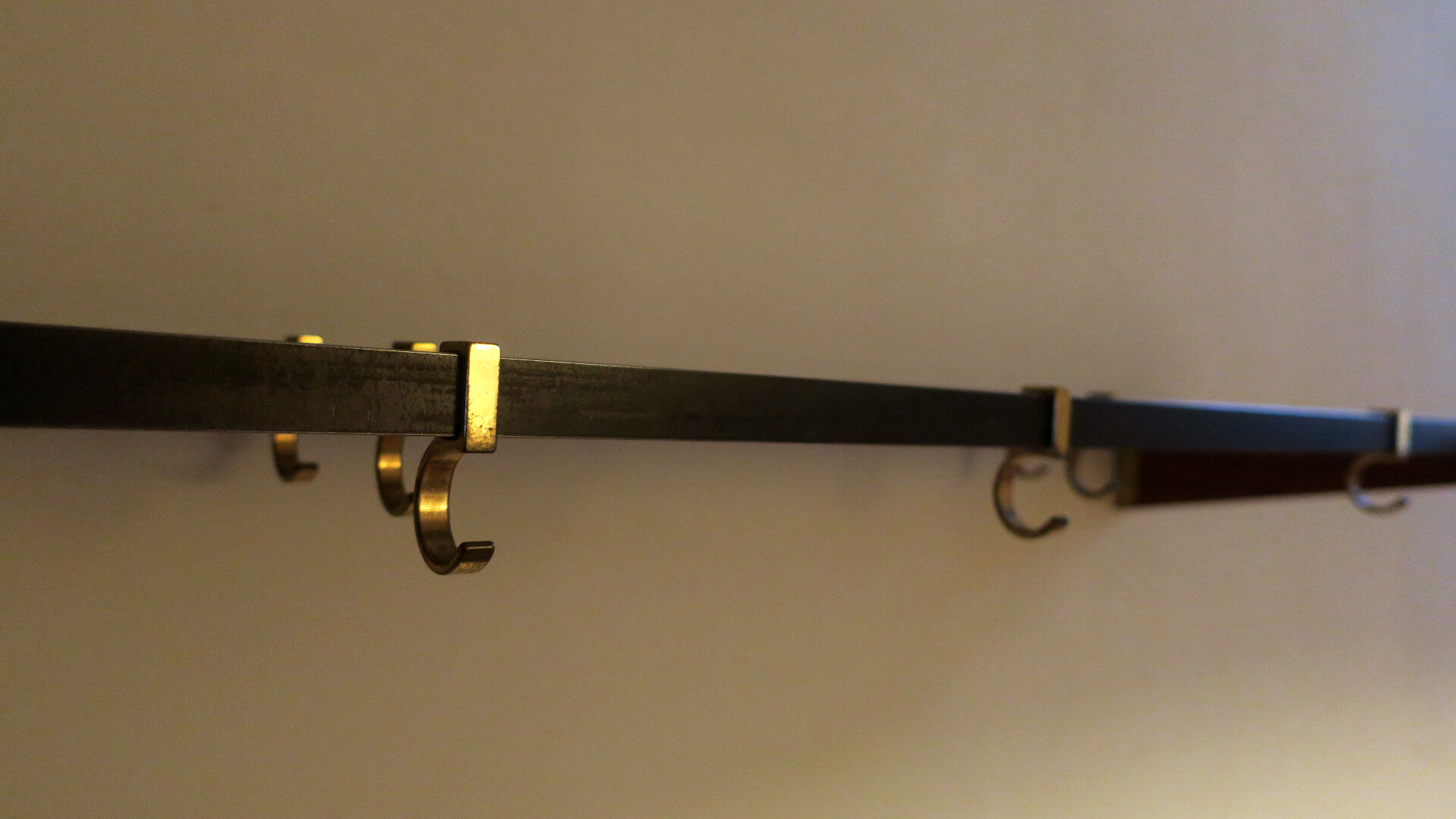 Teak, brass and black metal coat and hat rack, 1960