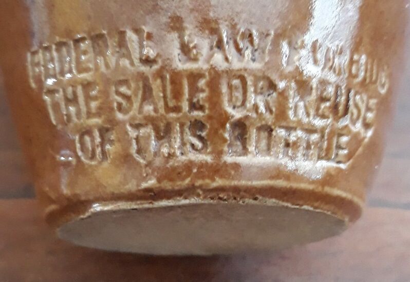 Small pitcher sandstone - 60s/70s - " Federal law forbids dirty. Or reuse of this bottles "