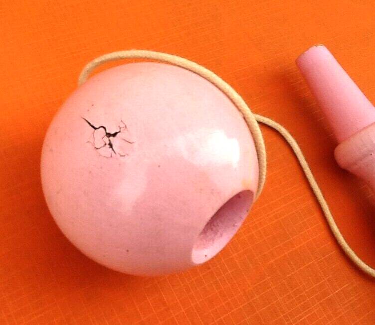 Wooden cup and ball game