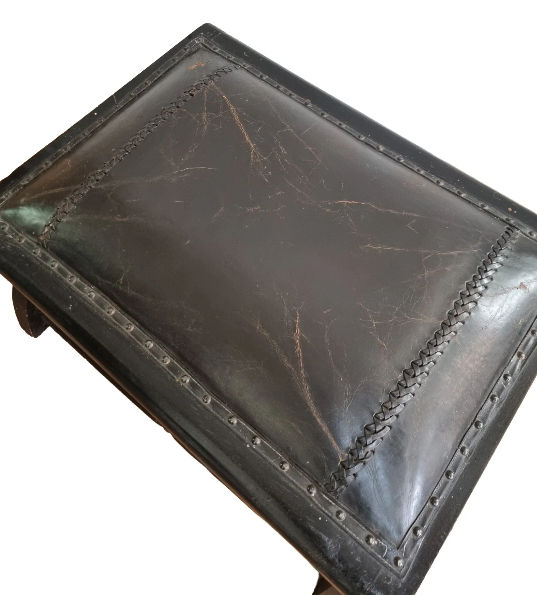 Black leather footstool with curved legs – vintage