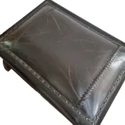 Black leather footstool with curved legs – vintage