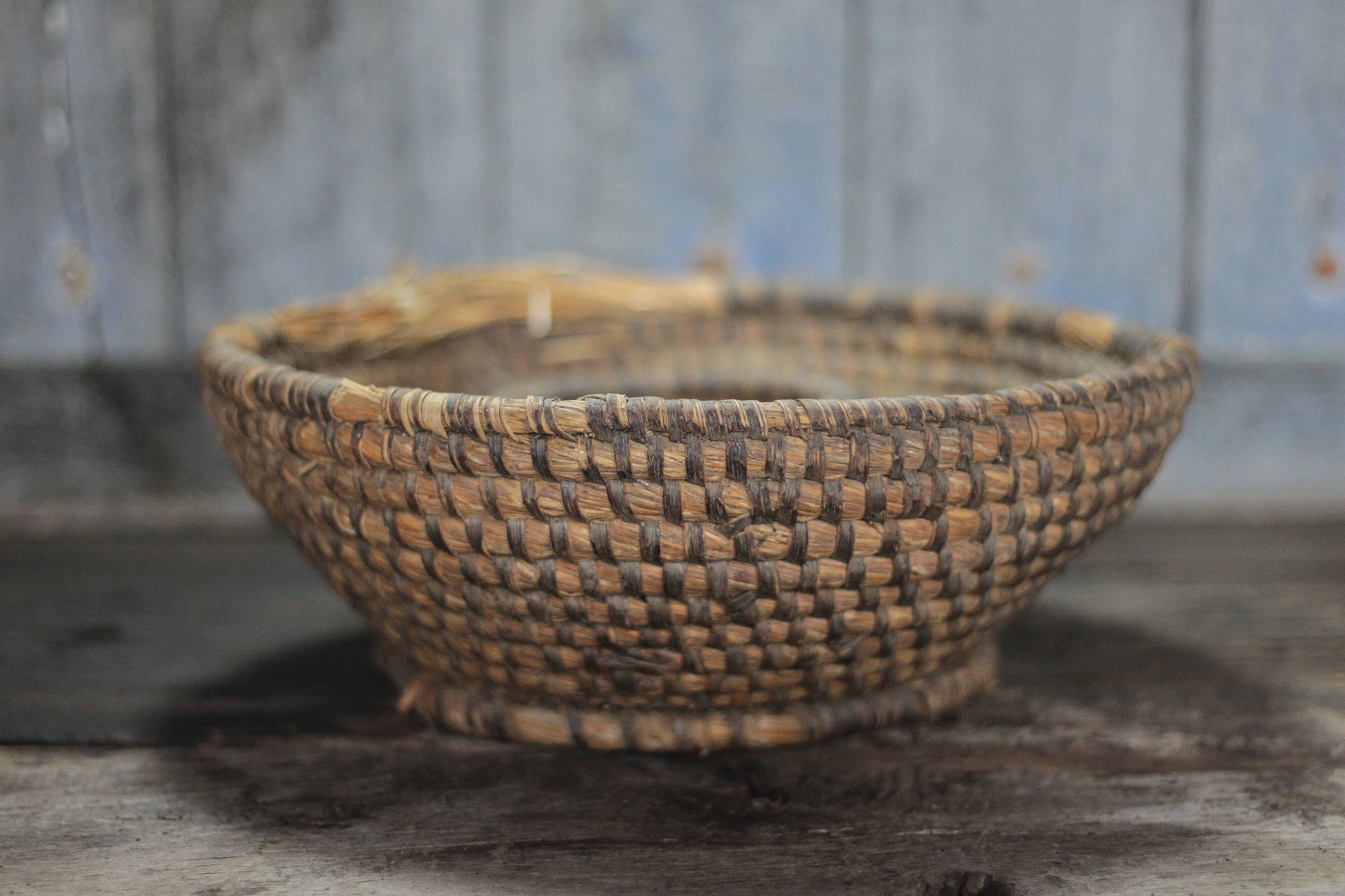 Old wicker basket, straw and bramble, woven basket, countryside.