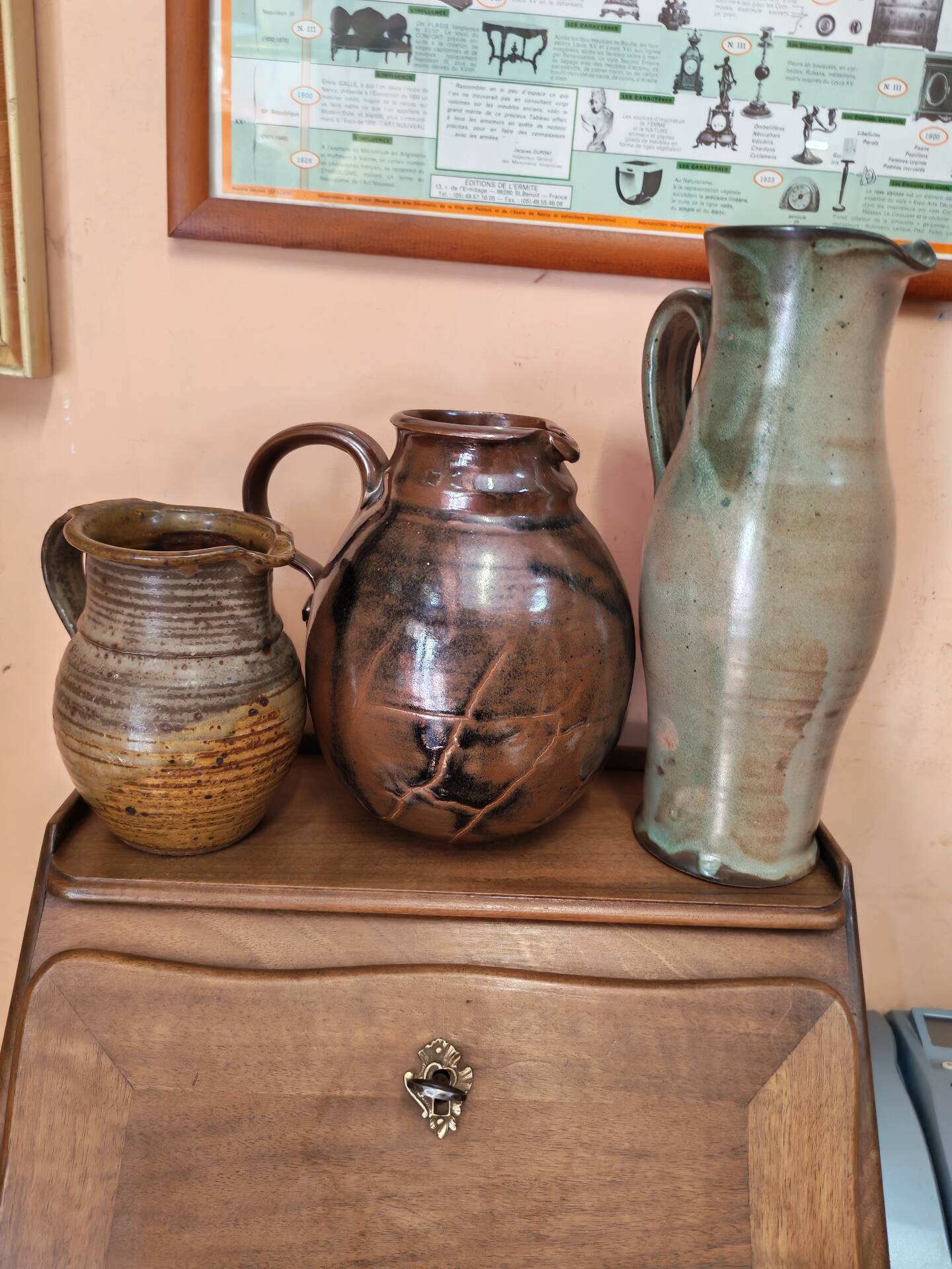 Set of three vintage ceramic jugs and a pitcher.