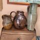 Set of three vintage ceramic jugs and a pitcher.