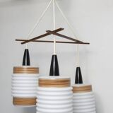 Scandinavian triangle pendant light in cascade with 3 opalines