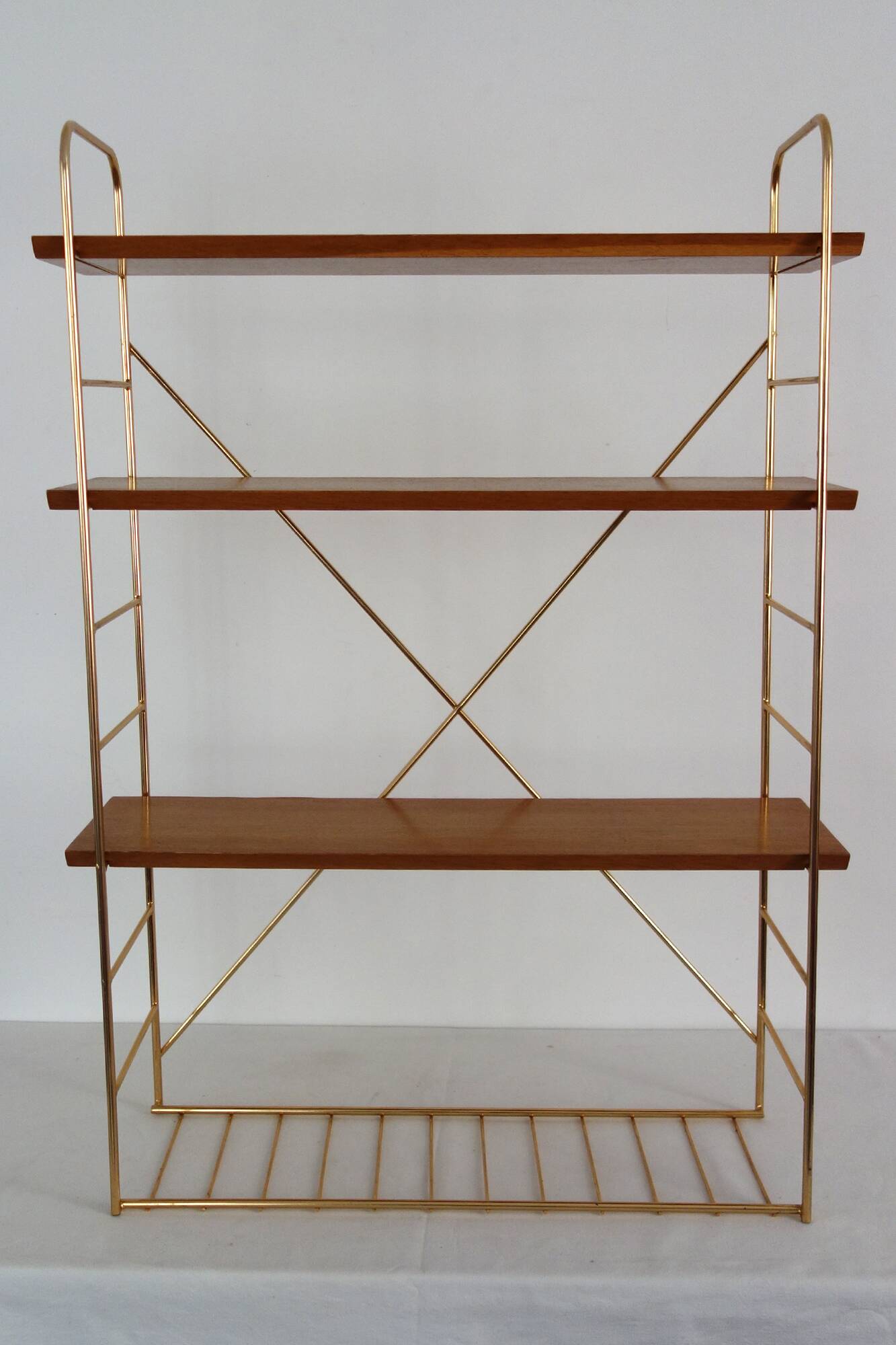 String wall shelf in gold metal and wood from the 60s