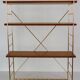 String wall shelf in gold metal and wood from the 60s