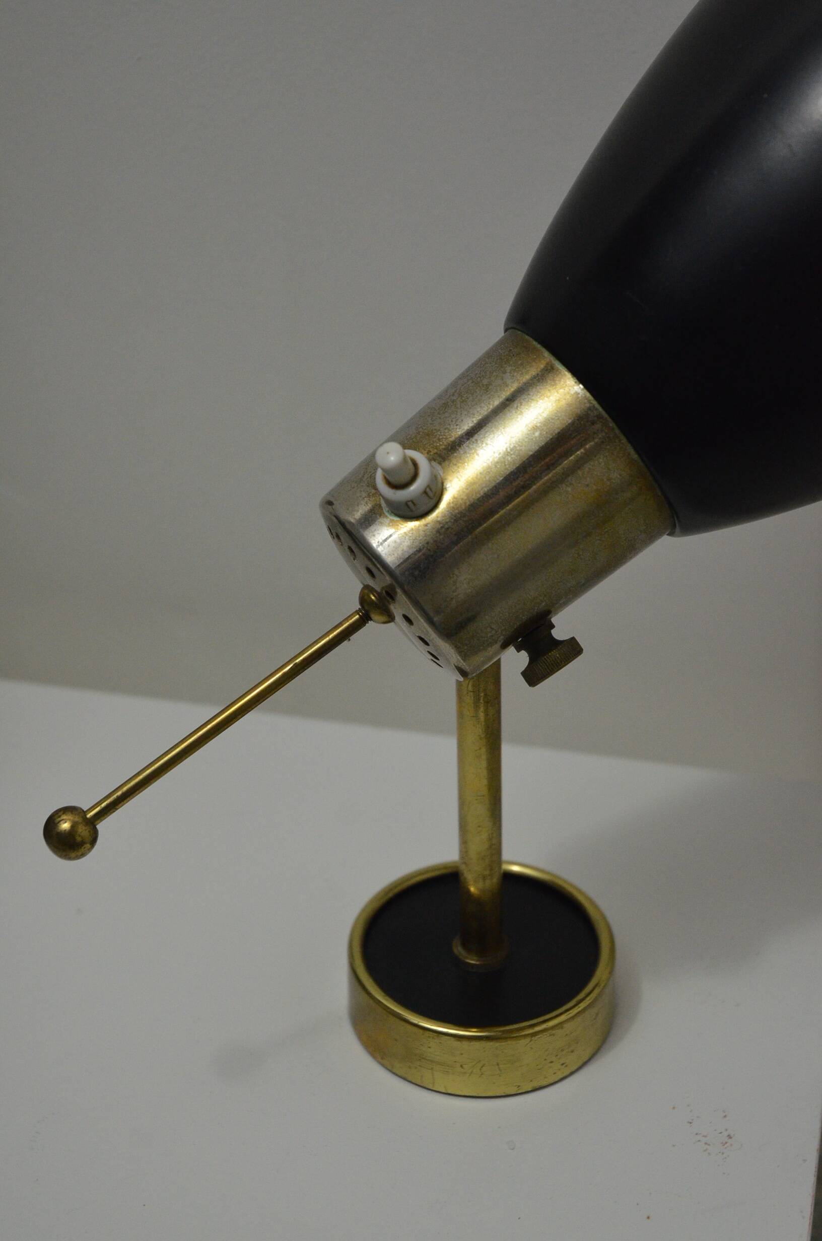 Pair of Monix wall lights in black lacquered metal and brass