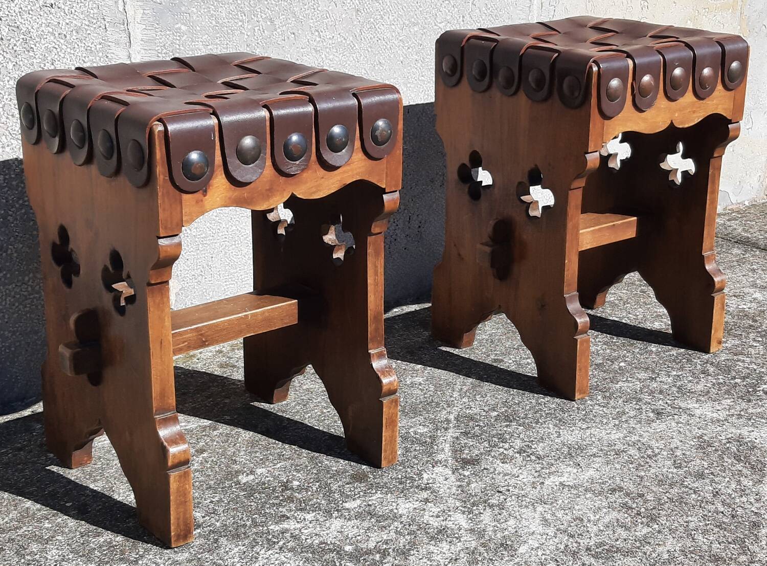 Pair of brutalist stools, leather seat.