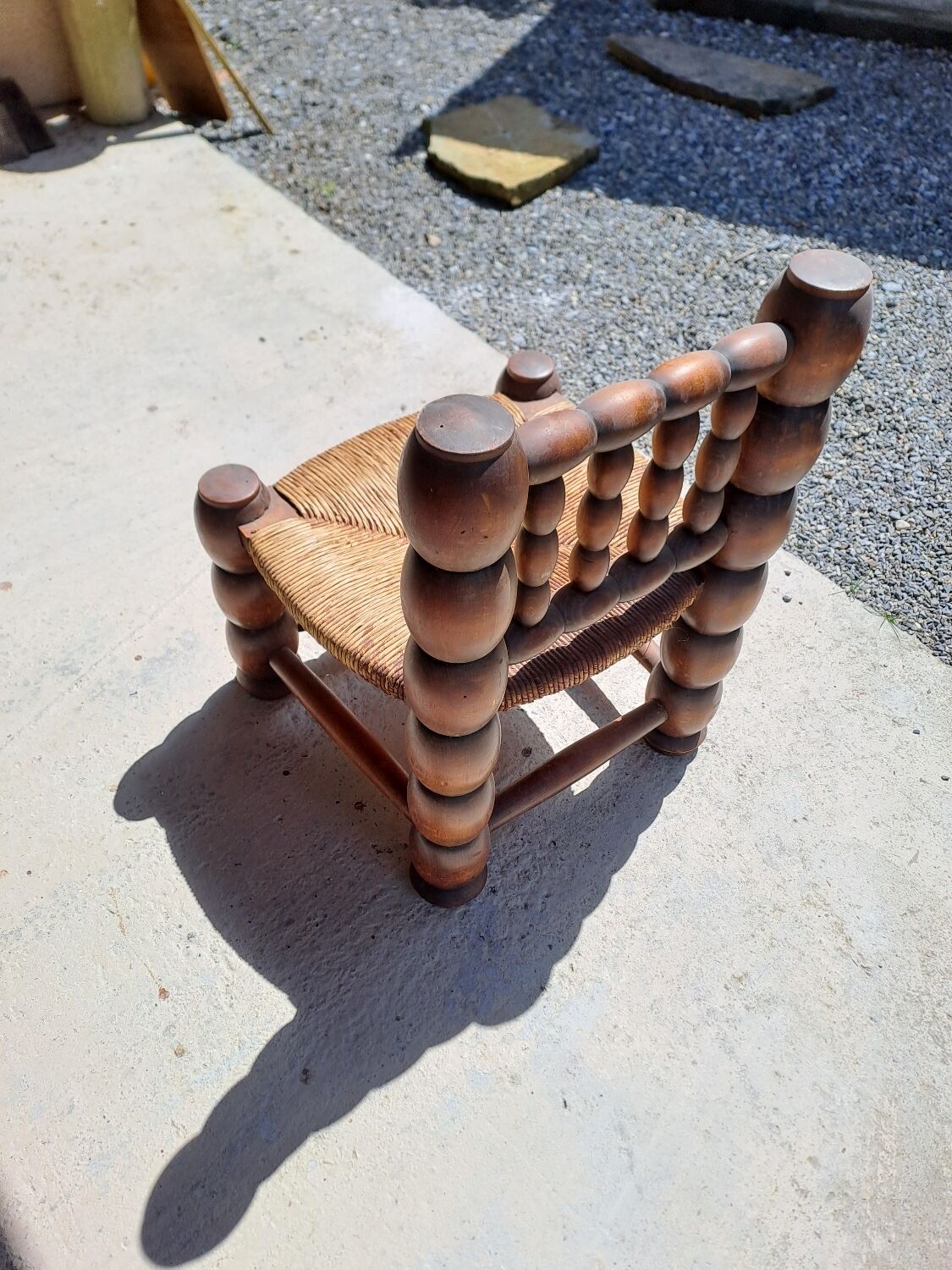 Low chair 50s oak and straw by the fire