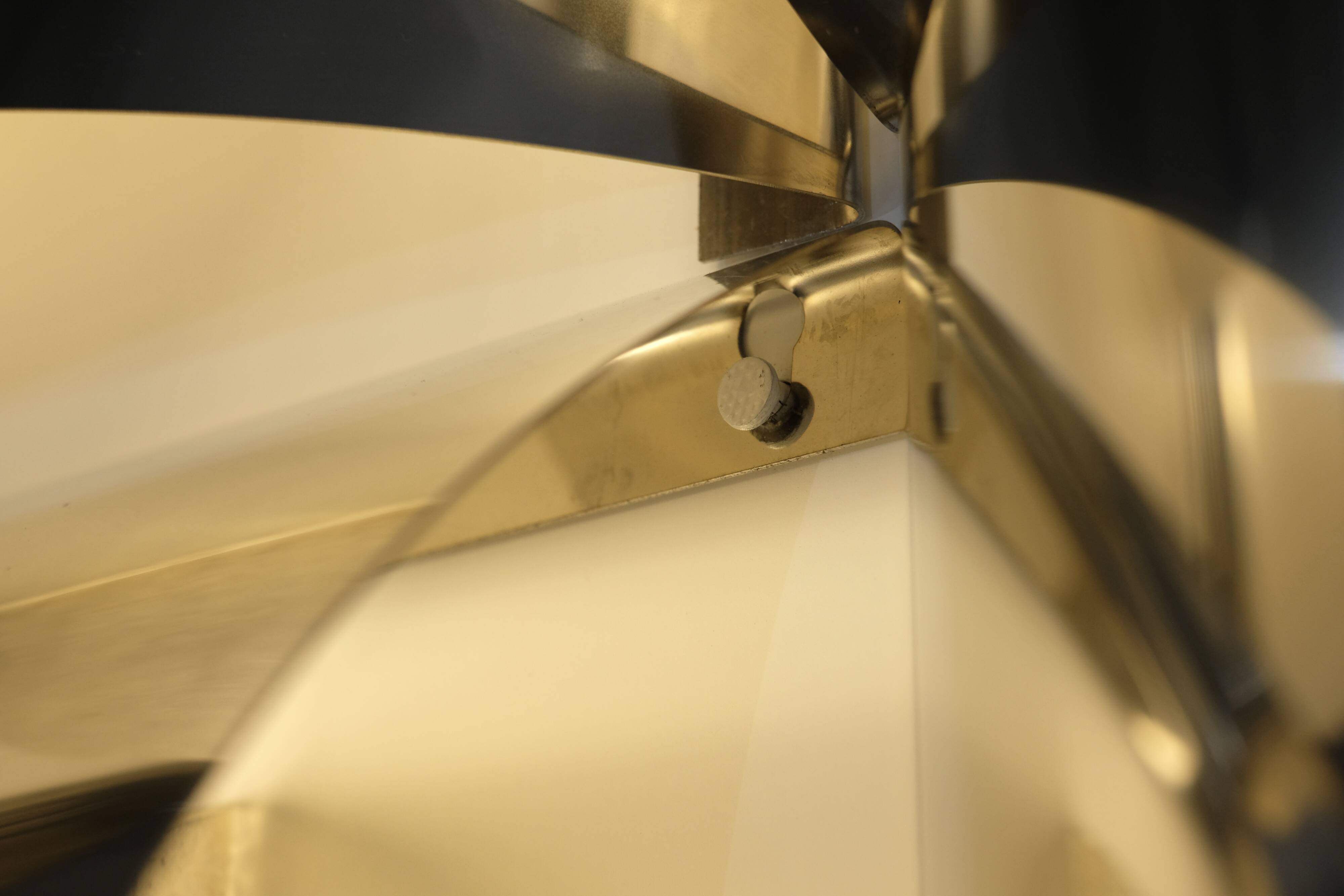 Contemporary wall light in stainless steel and metal.