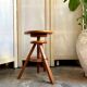 Wooden tripod stool with screw