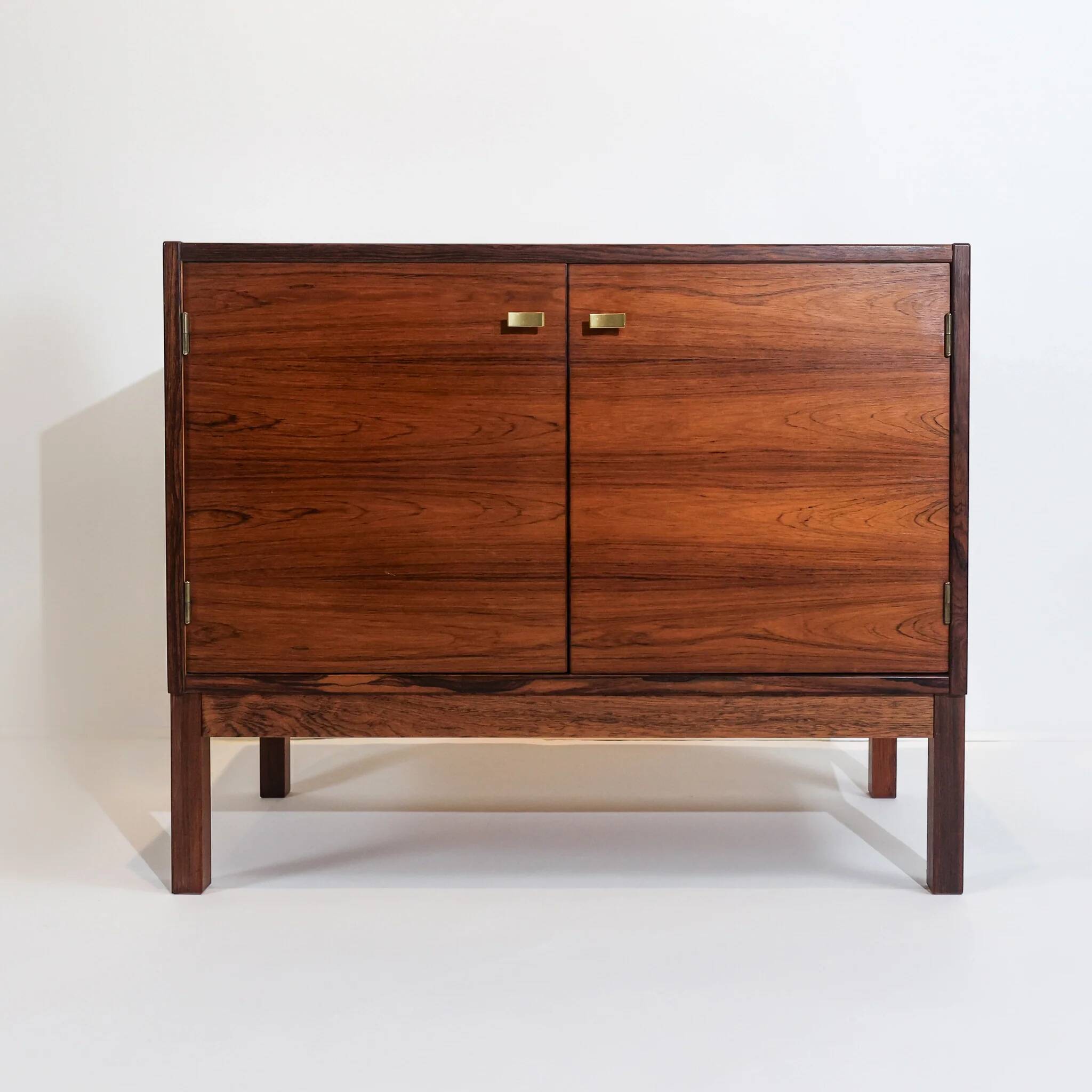 Vintage Swedish commode in rosewood with brass handles.