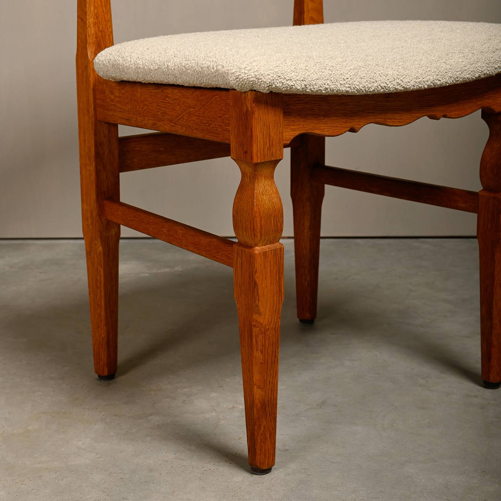 Henning Kjærnulf dining chairs set in Oak and Off White Bouclé, Denmark, 1960s