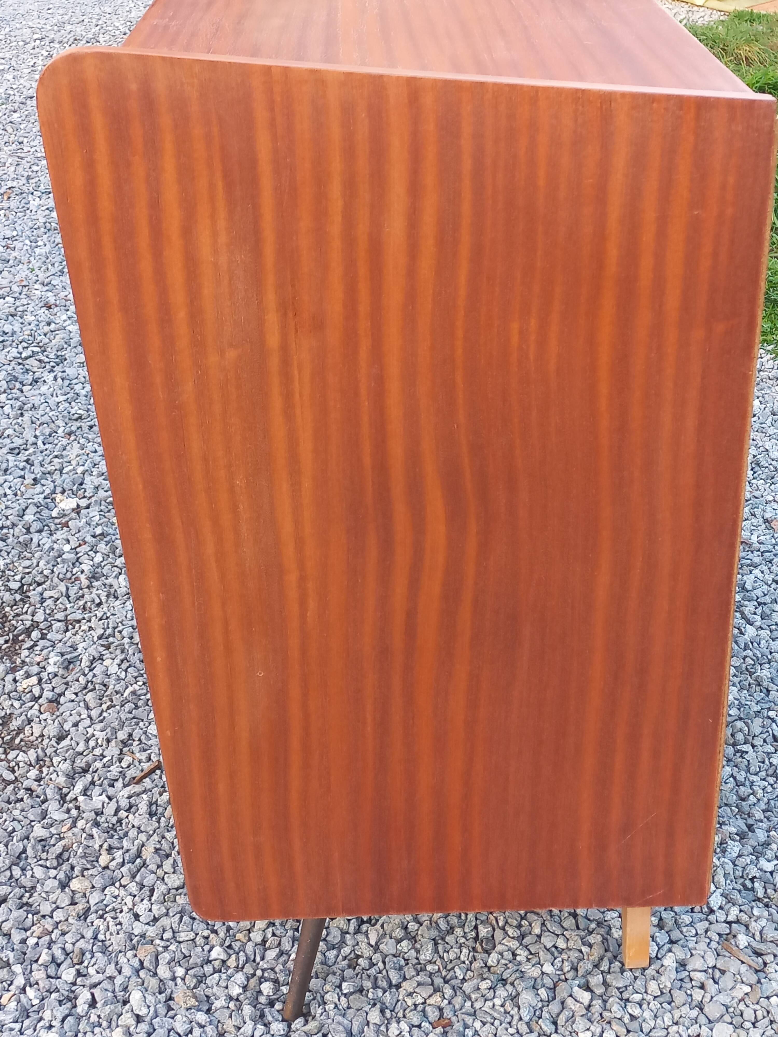 Vintage mahogany commode with metal tapered legs, 4 drawers, 1950s.