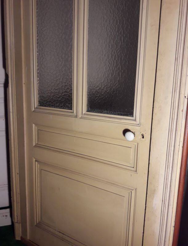 Large glazed door and its old glazed transom.