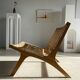 Reclining armchair in natural wood and woven rattan