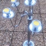 Standing candlestick in stainless steel metal with 5 movable branches, with smooth ring for 4 cm candles.