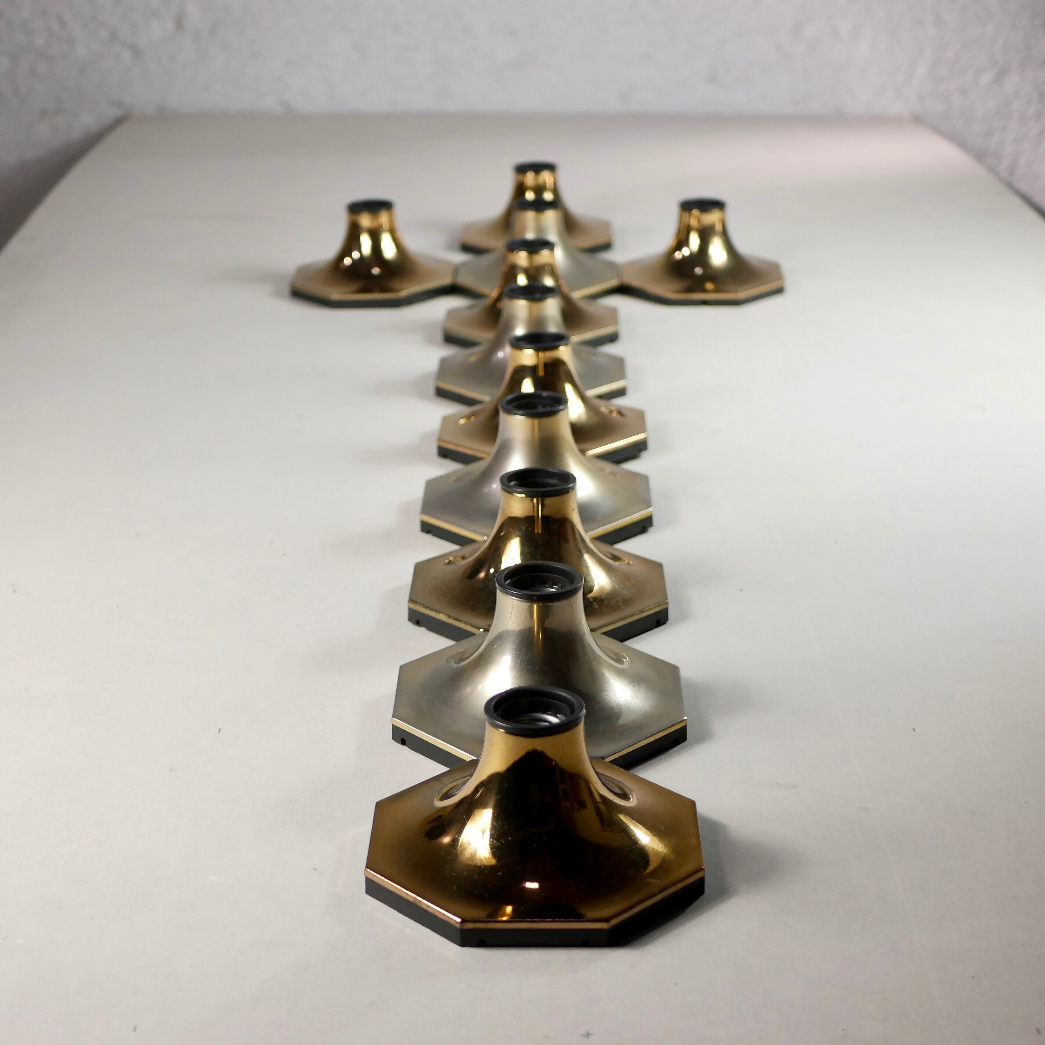Suite of 11 octagonal brass sconces by Motoko Ishii