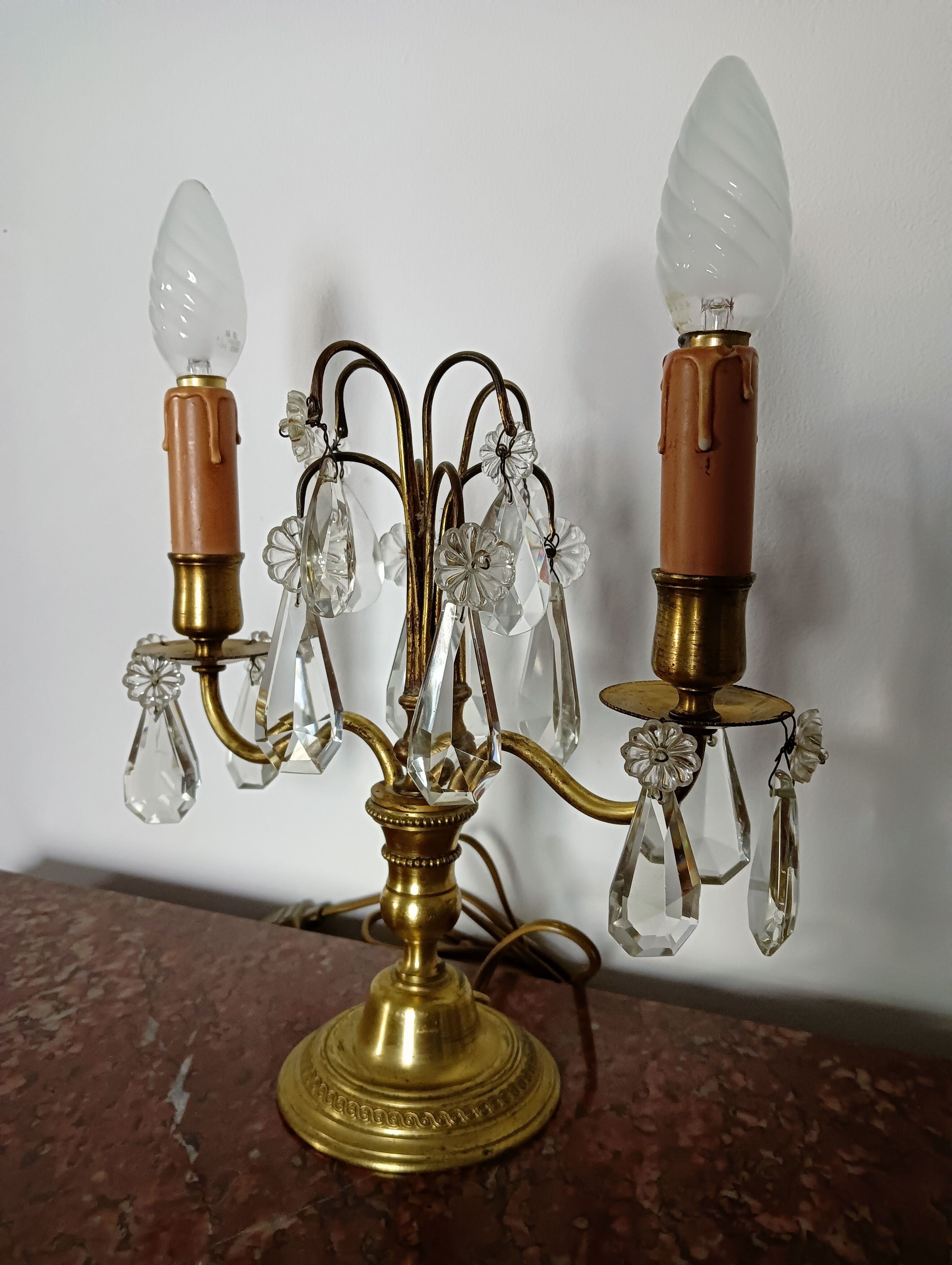 Pair of bronze girandoles with crystal pendants, two arms of lights.