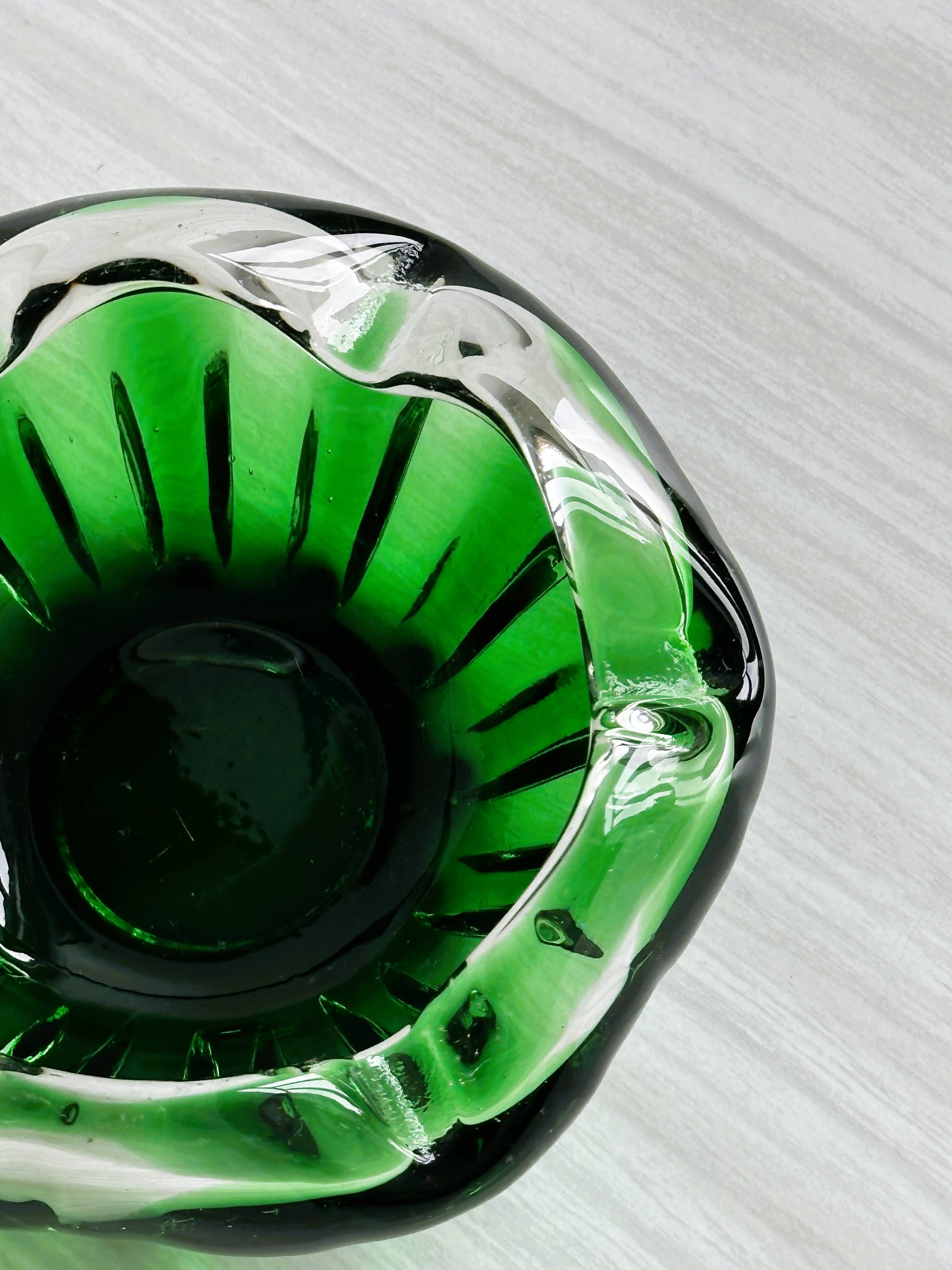 Translucent green ashtray.