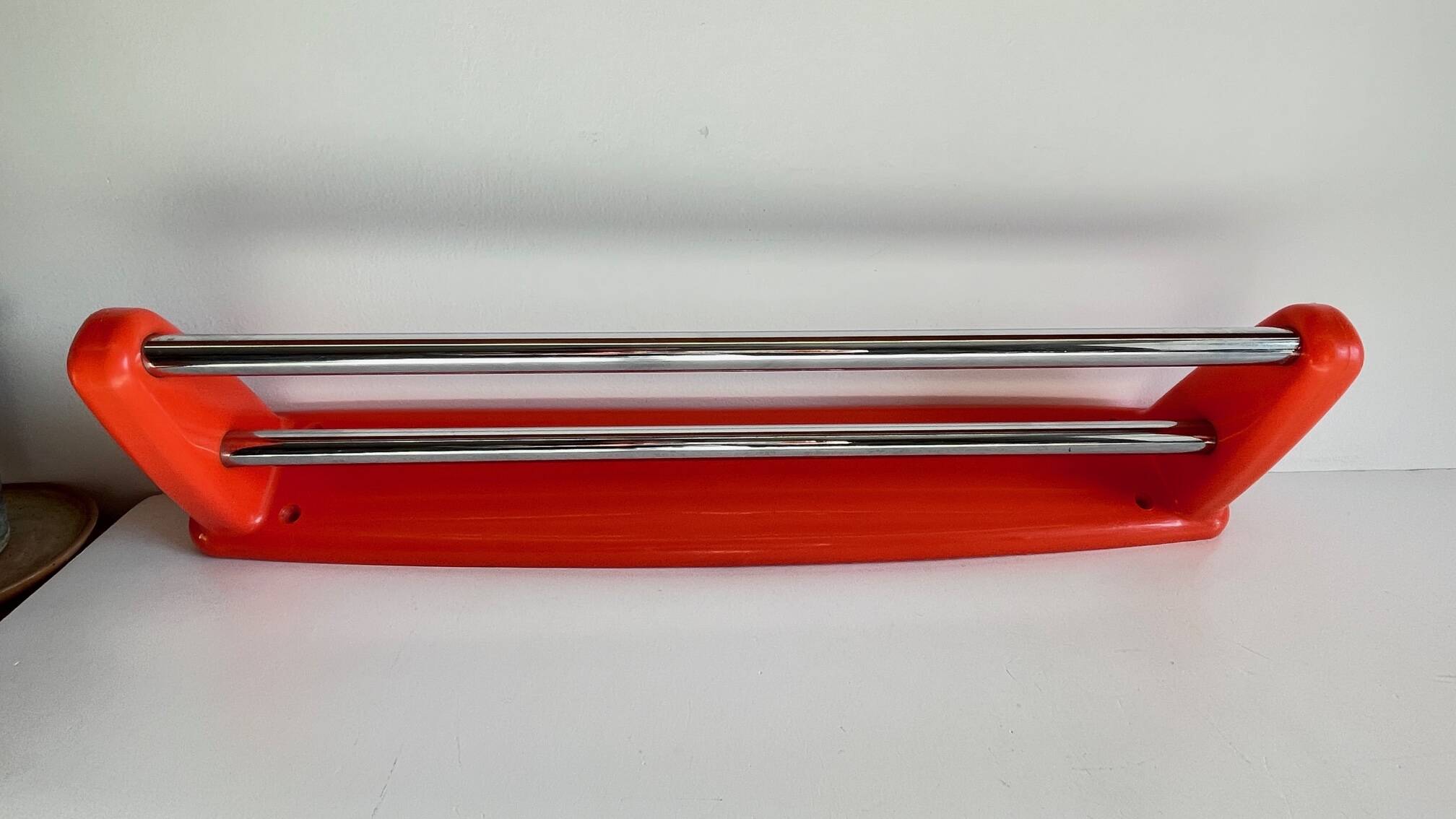 Orange towel rack by Syla from the 70s