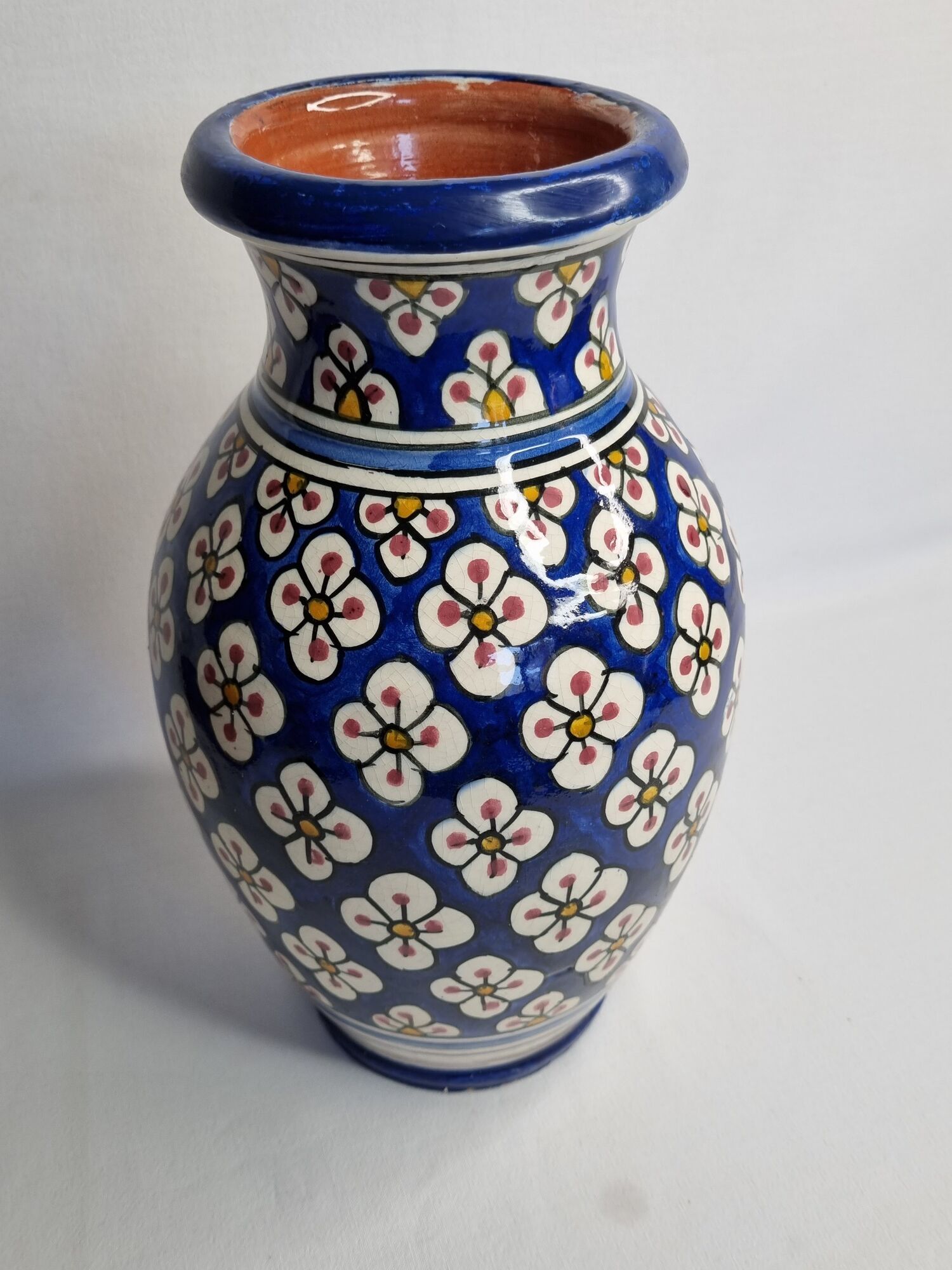 Moroccan handicraft vase in blue enamelled terracotta decorated with flowers, 32 cm