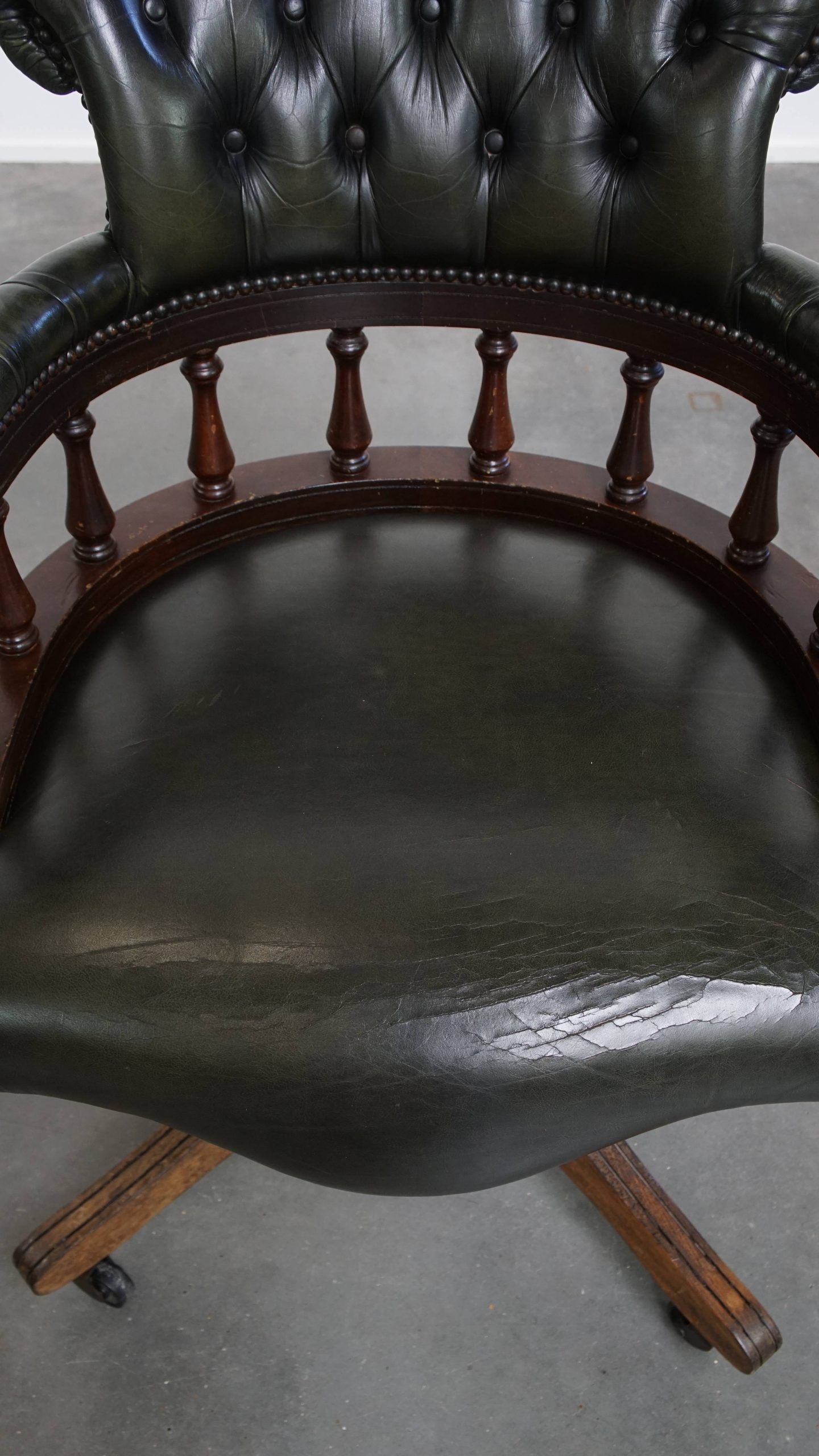 Adjustable green leather and wood Chesterfield office chair with swivel