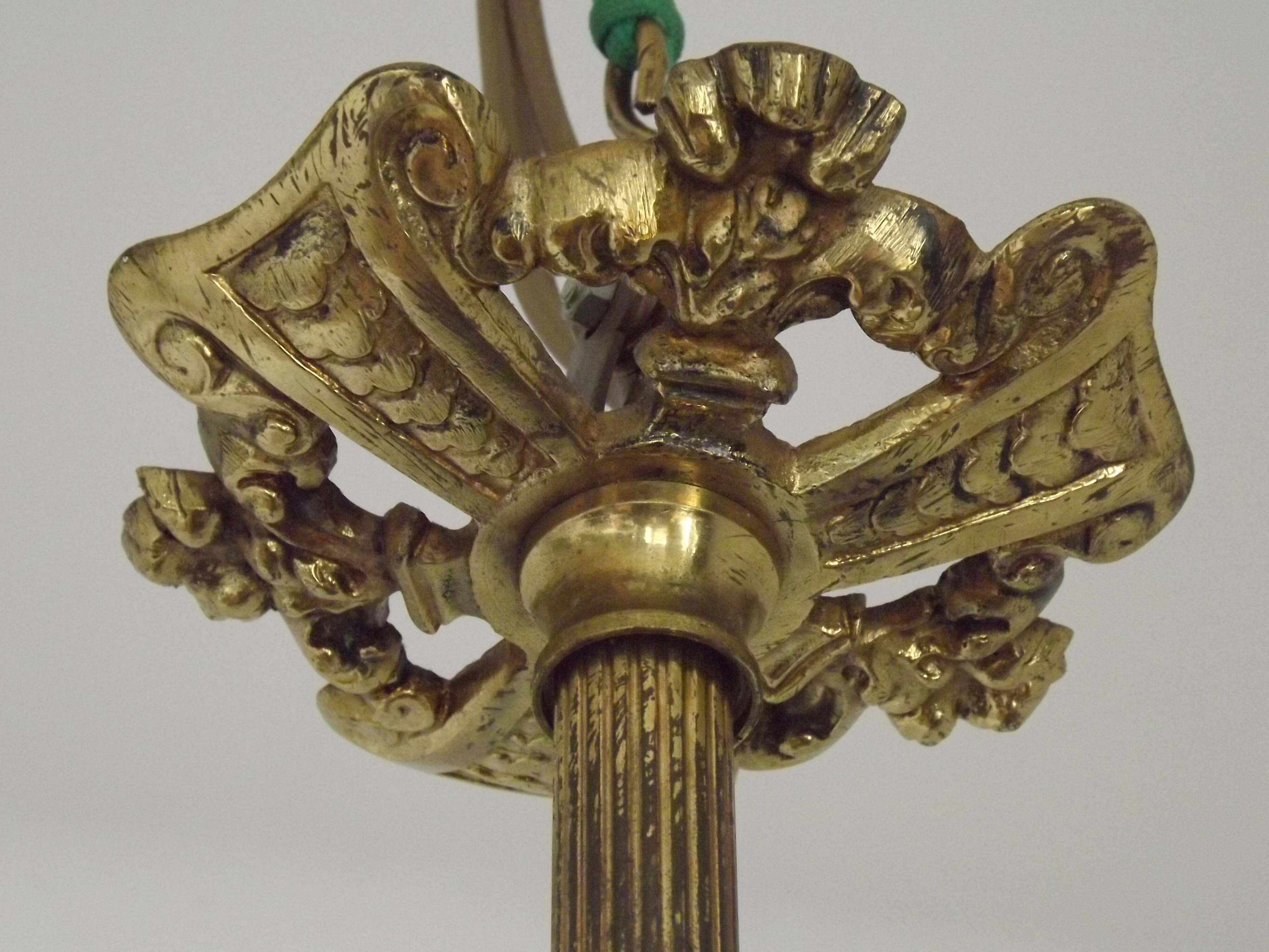 Art Nouveau three-light chandelier in bronze with orange and green glass shade, France.