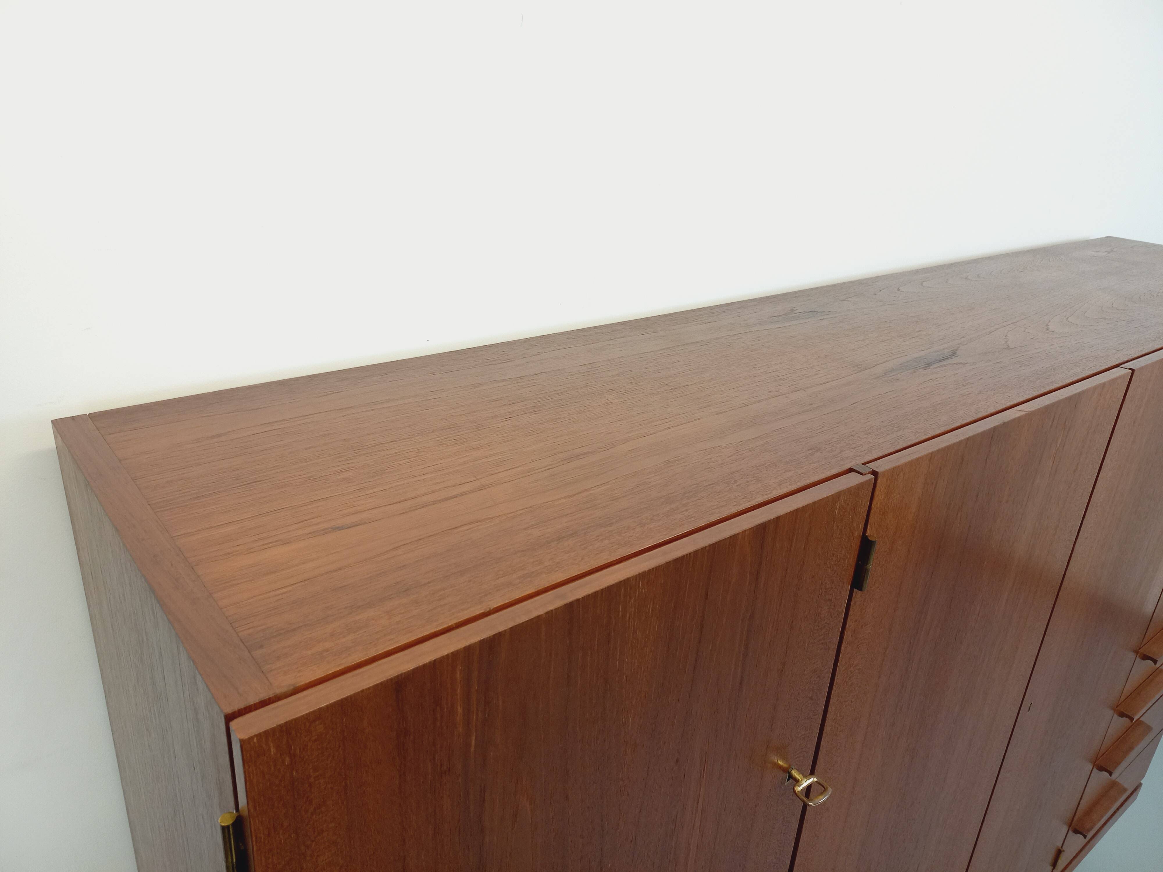 High Scandinavian modernist vintage sideboard in teak and black metal.