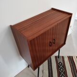 Piece of furniture on high feet metal compass