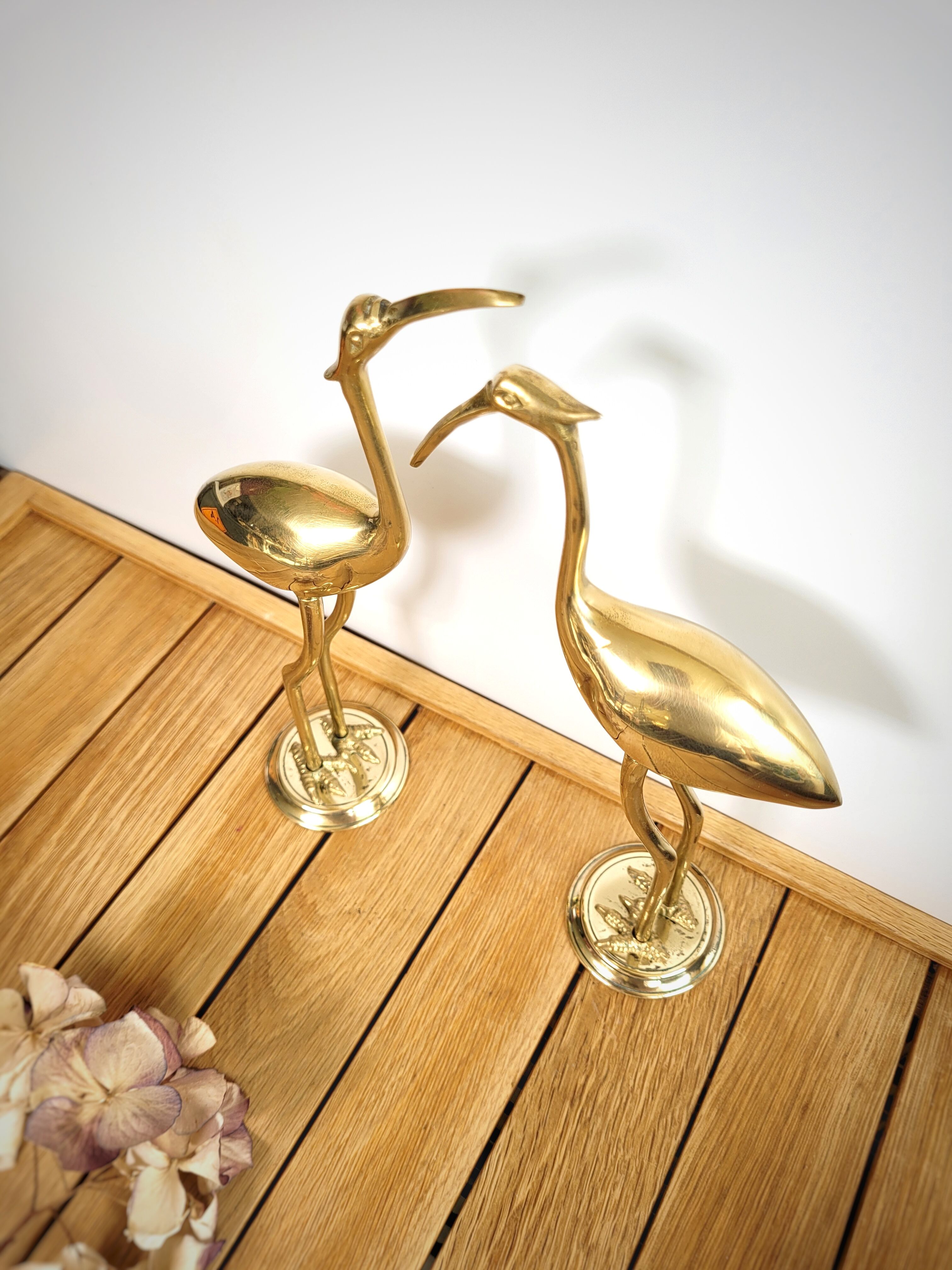 Duo of brass herons