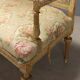 Antique neoclassical canapé in carved wood from the 19th century.