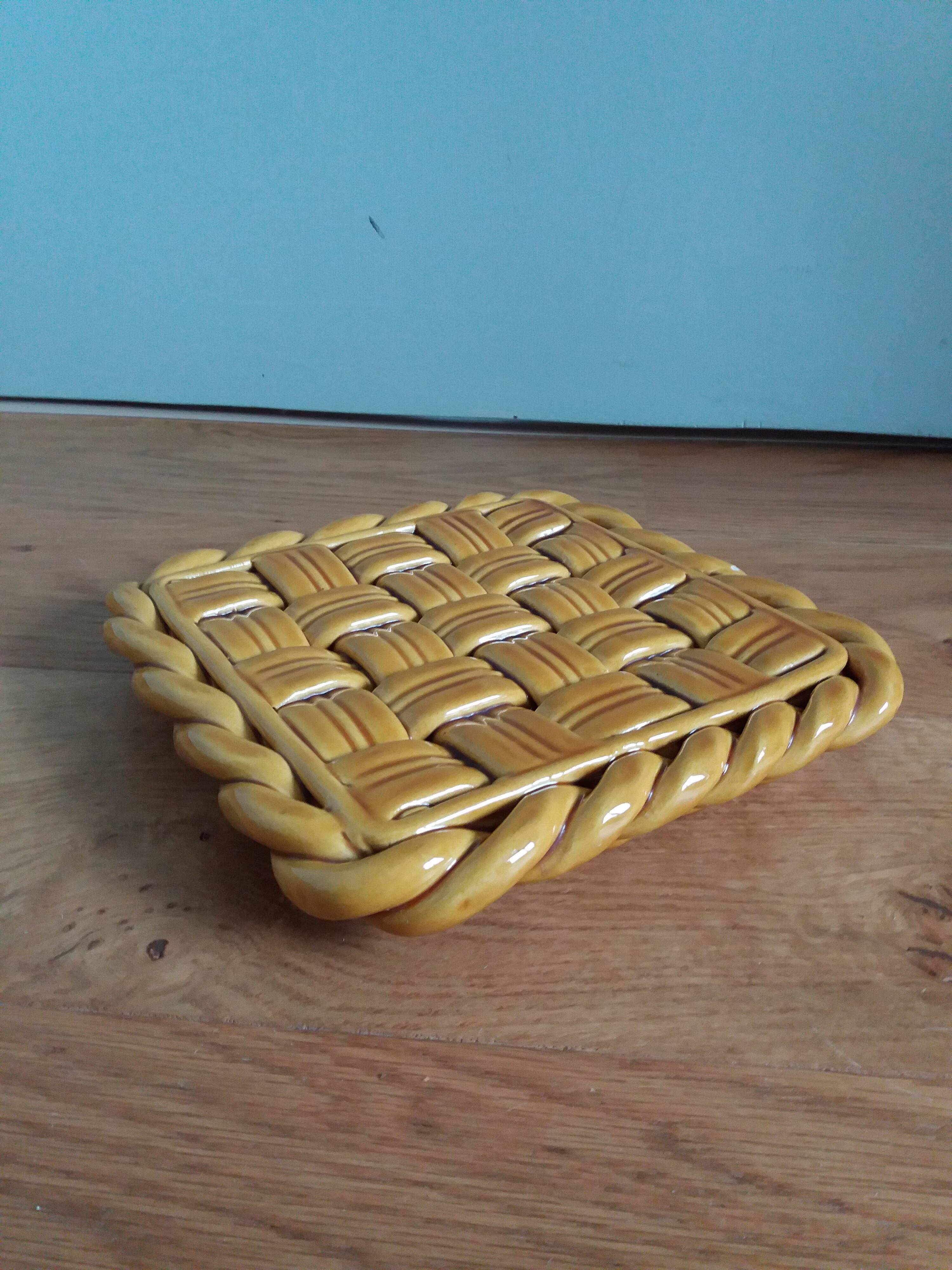 Openwork woven ceramic trivet