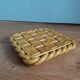 Openwork woven ceramic trivet