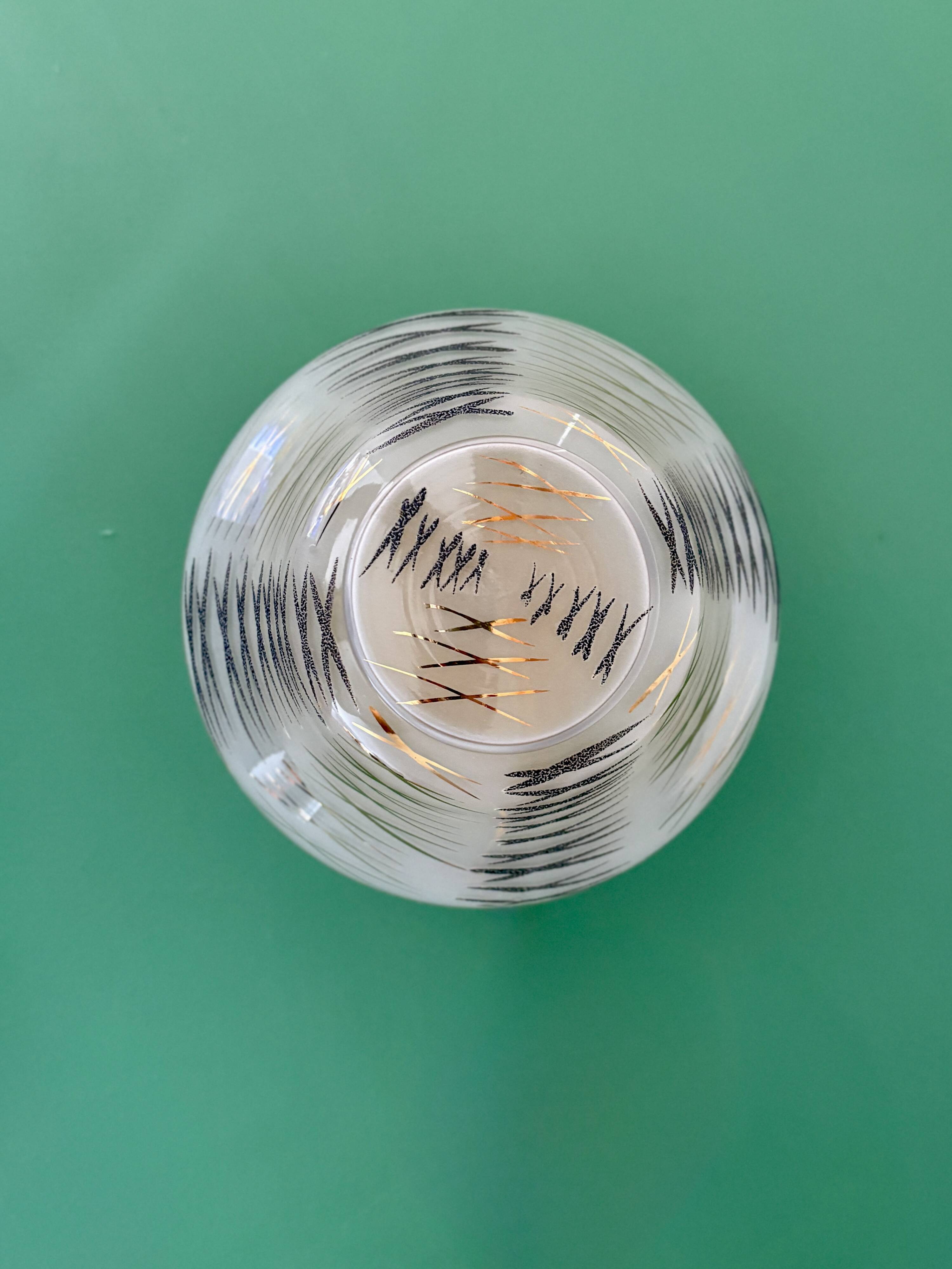 Vintage Art Deco globe wall/ceiling light in white, black, and gold glass.