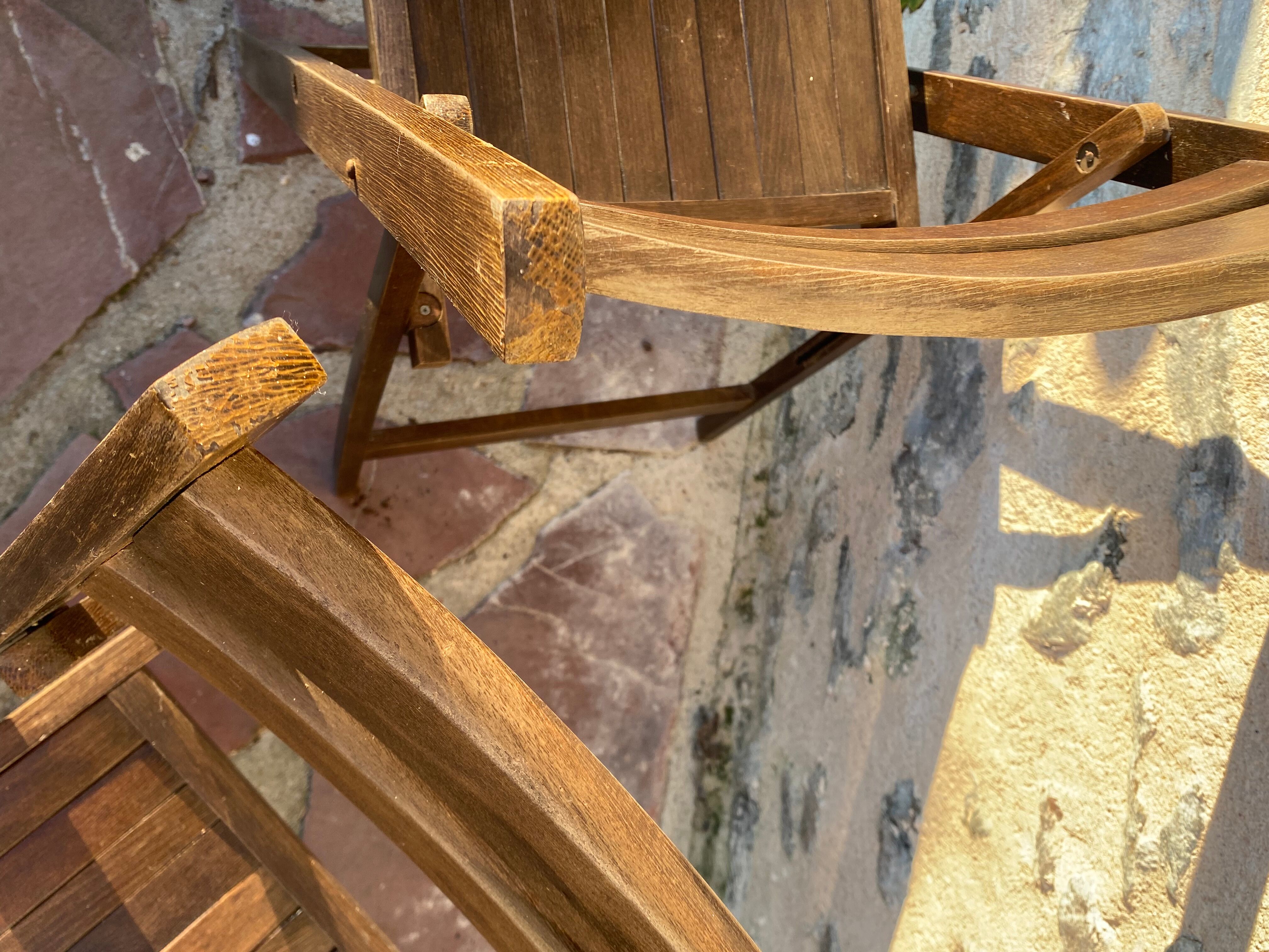 Three wooden folding chairs