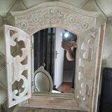 Carved white wood mirror 1990 decorative carved with opening shutters on a square mirror