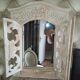 Carved white wood mirror 1990 decorative carved with opening shutters on a square mirror