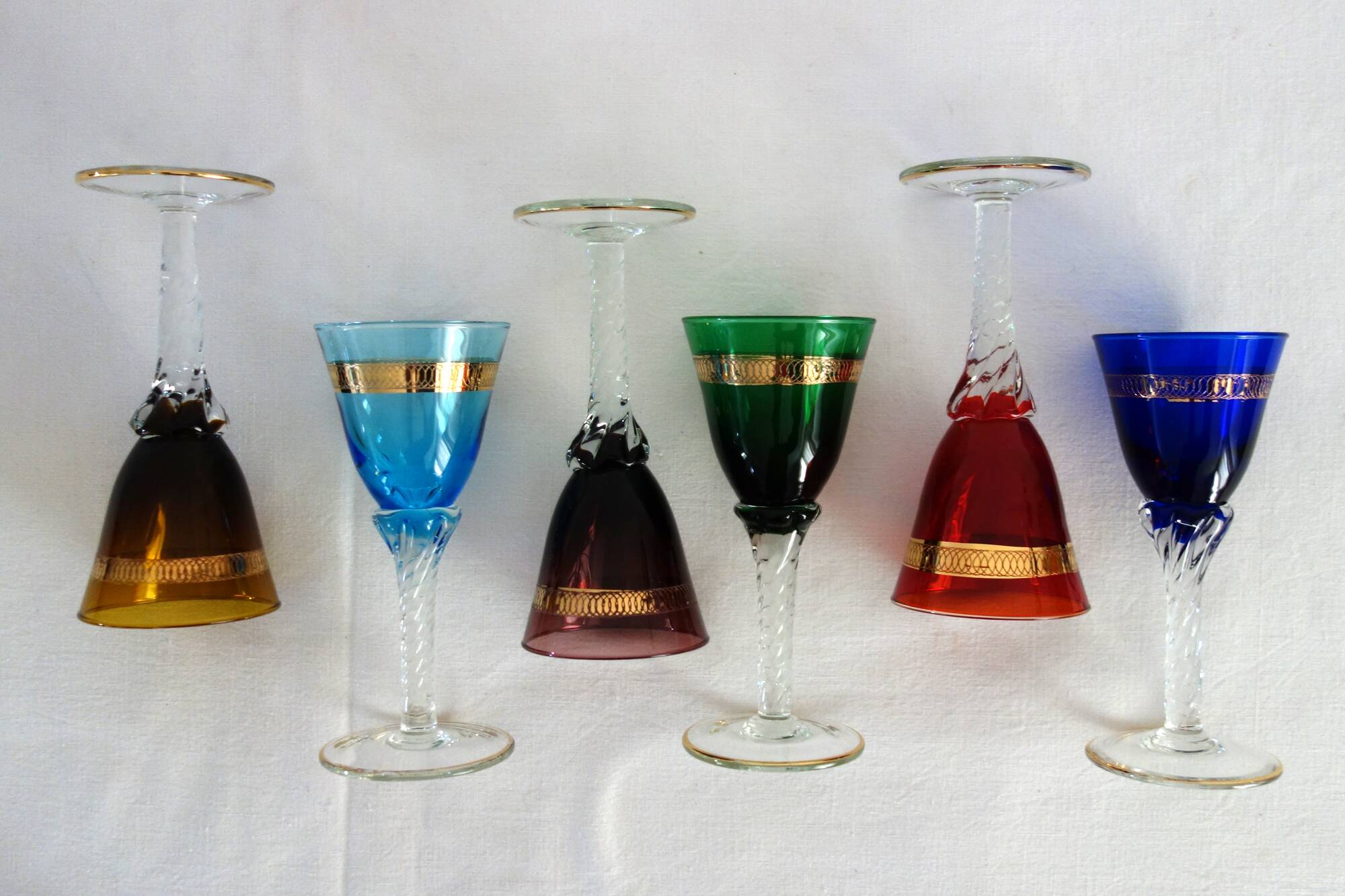 6 multicolored aperitif glasses with twisted legs