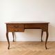Retro wooden desk with curved legs