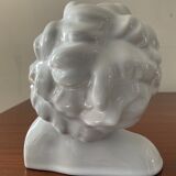 Cherub child bust in enamelled porcelain
